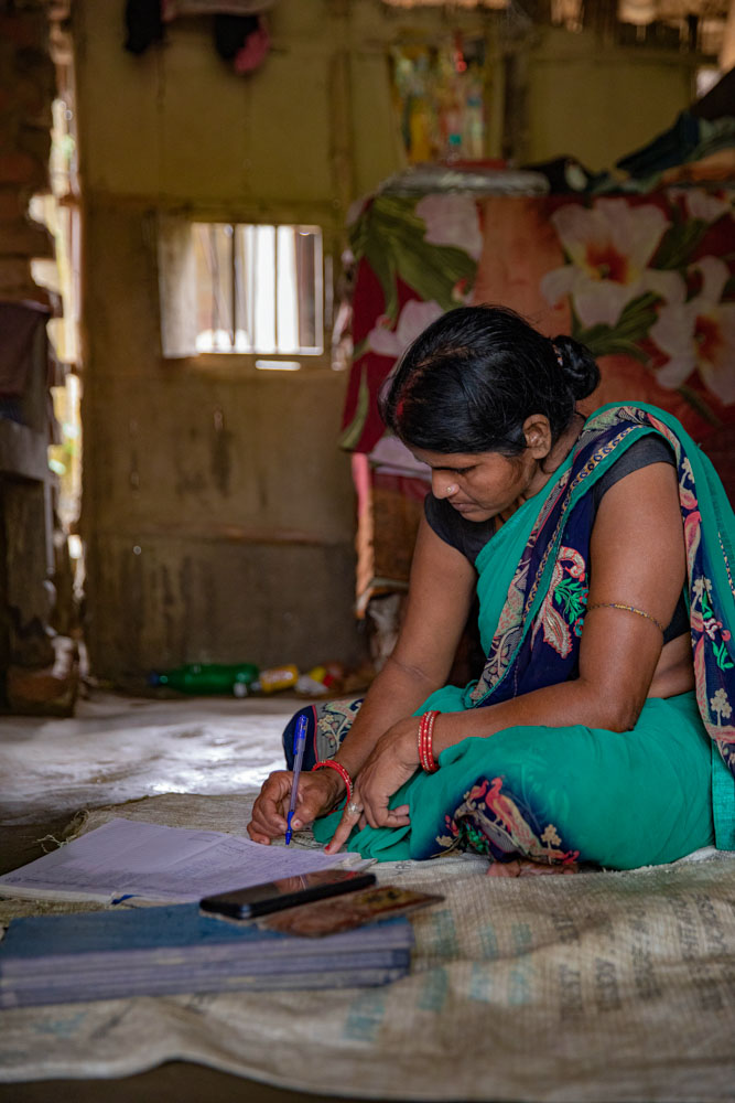 A women writing in her notebook.
