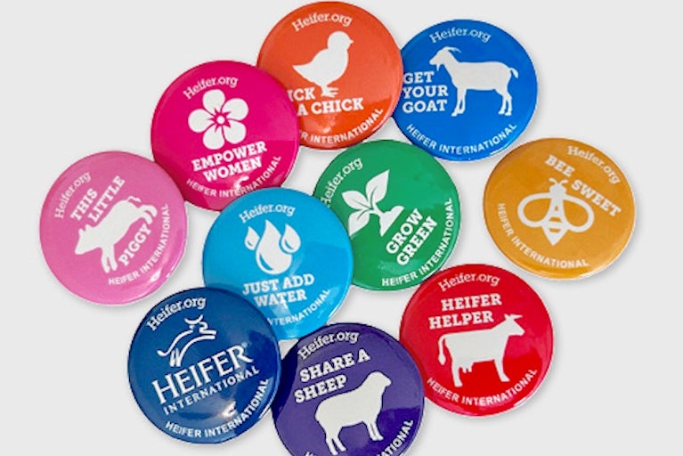 Colorful animal buttons on a white table.