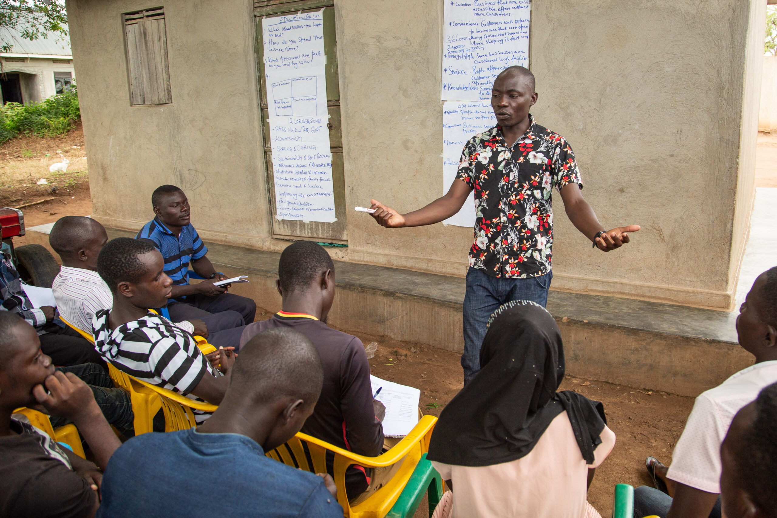 A man directs a class of East Africa Youth Inclusion Project.