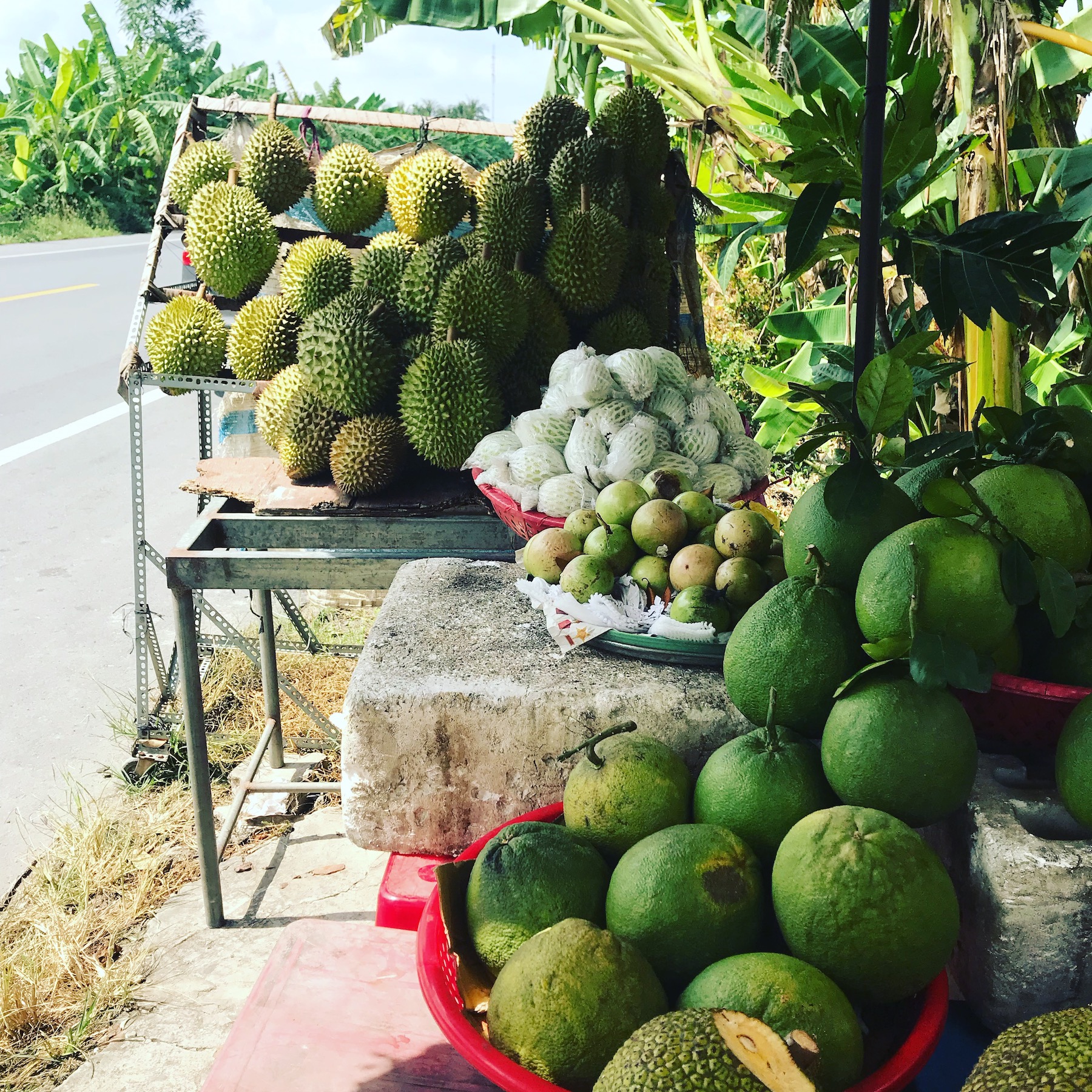 Photo of durian being sold at a local market in Vietnam.