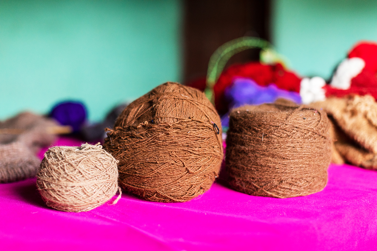 Alpaca yarn hand-spun by Heifer project participants, in varying natural colors and thickness.