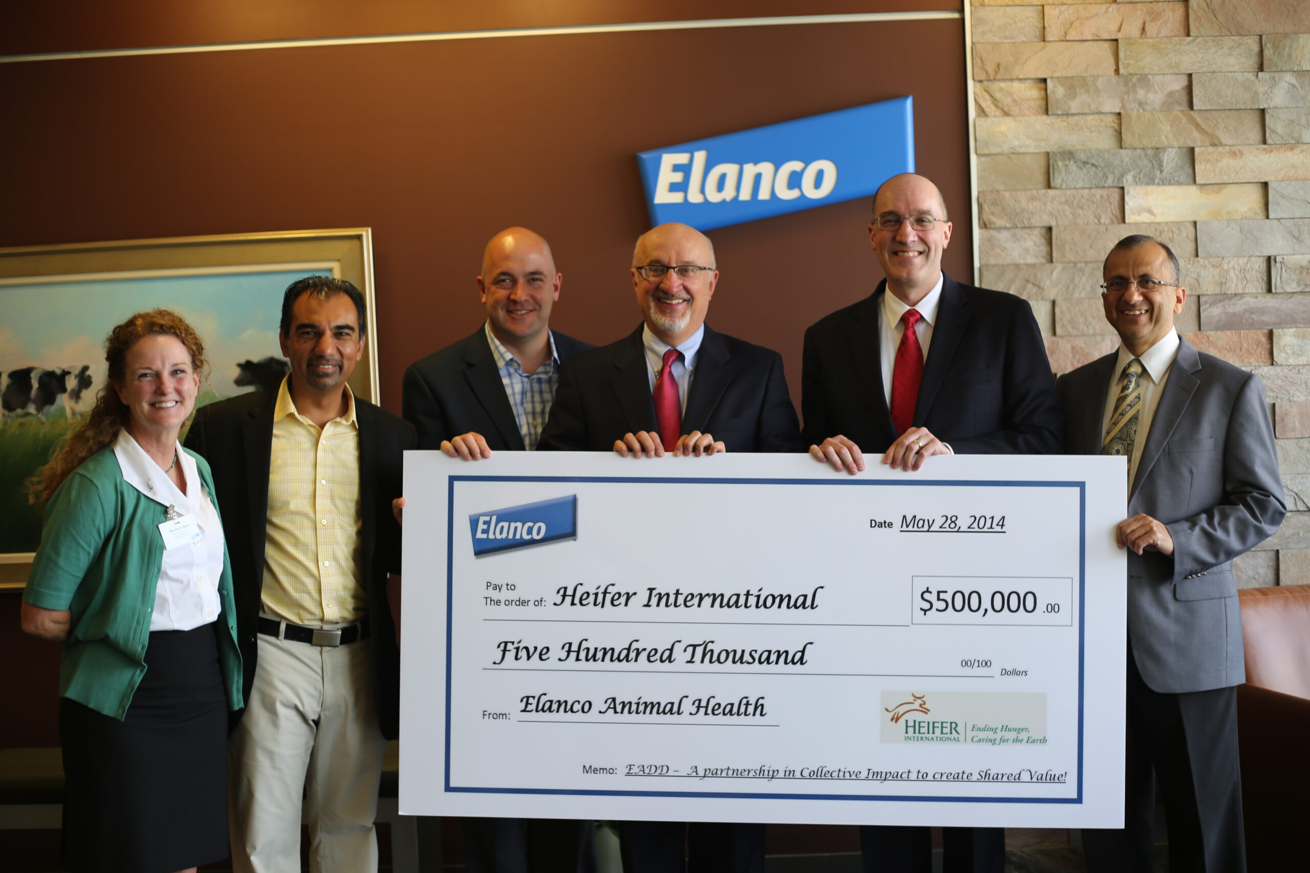 Elanco presents a check to Heifer International supporting the East Africa Dairy Development project. From left to right: Marleen New, Senior Director of Global Partnerships and Alliances, Heifer International, Noel Paul, Consultant - Global Shared Value Global Leader, Elanco, Mitch Davis, Director - Global Shared Value, Elanco, Pierre Ferrari, President and CEO, Heifer International Rob Smith, Senior Director- Corporate Philanthropy, Eli Lilly and Company; also, President of Lilly Foundation, Rakesh Kapoor, EADD Regional Director, Heifer International From Left to Right: Marleen New, Senior Director of Global Partnerships and Alliances, Heifer International Noel Paul, Consultant, Global Shared Value, Mitch Davis, Director - Global Shared Value, Pierre Ferrari, President and CEO, Heifer International, Rob Smith, Senior Director- Corporate Philanthropy, Eli Lilly and Company; also, President of Lilly Foundation, Rakesh Kapoor, EADD Regional Director, Heifer International
