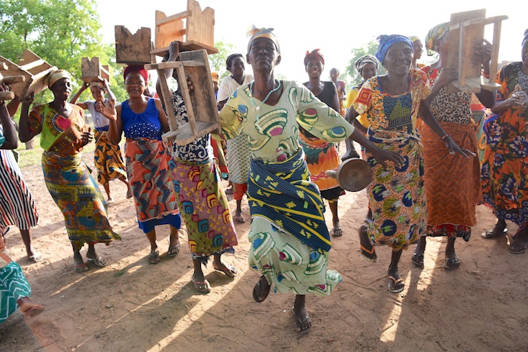 Group of women with stools.
