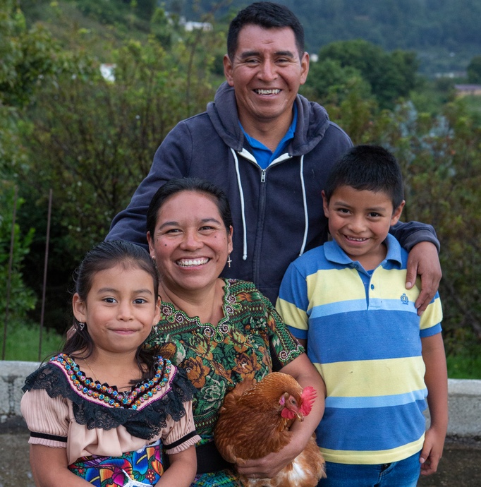 Juana and her husband, Carlos, with two of their children.
