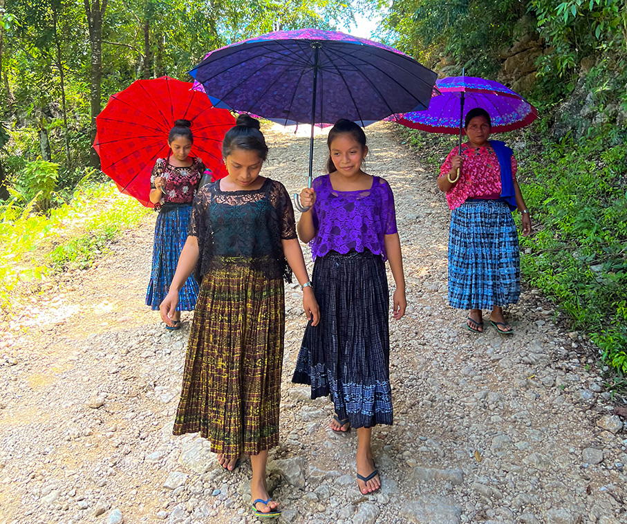 Zoila and her daughters take a walk on their farm.