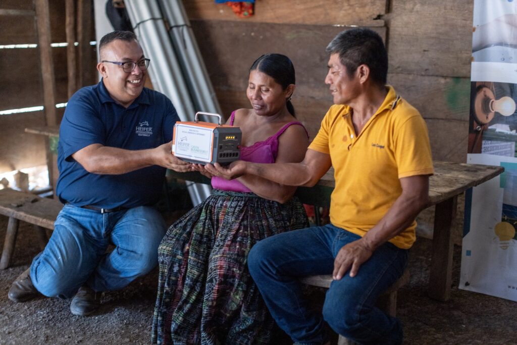 Heifer staff and farmers work together.