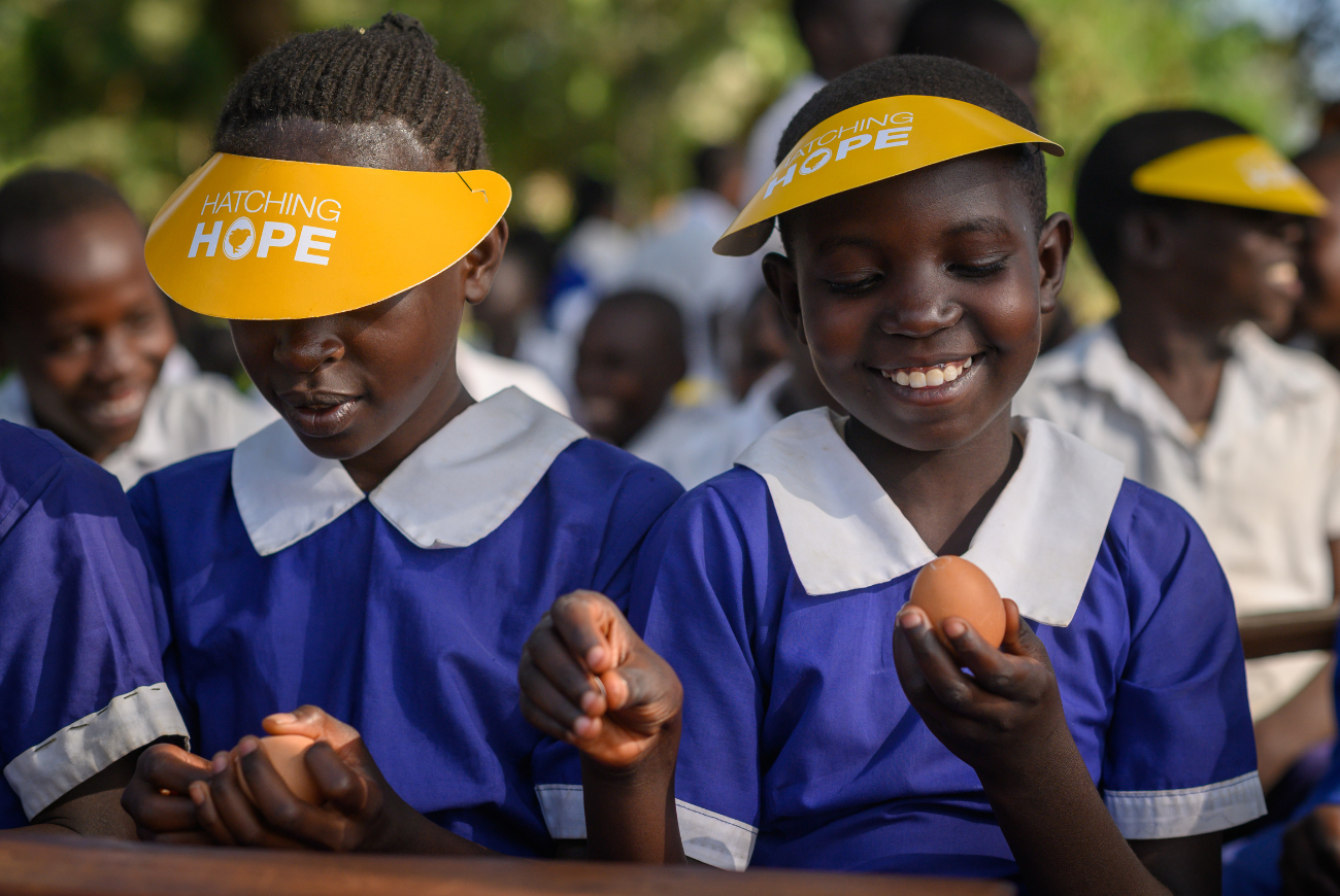 Pupils eating eggs.