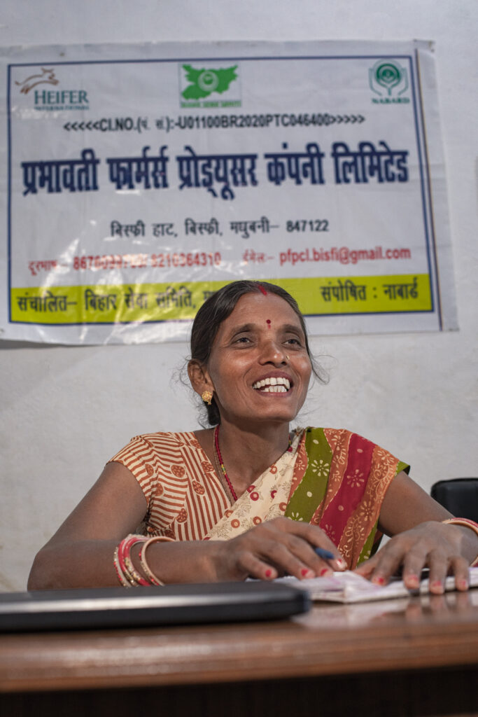 Woman speaks with officials at an FPO office.