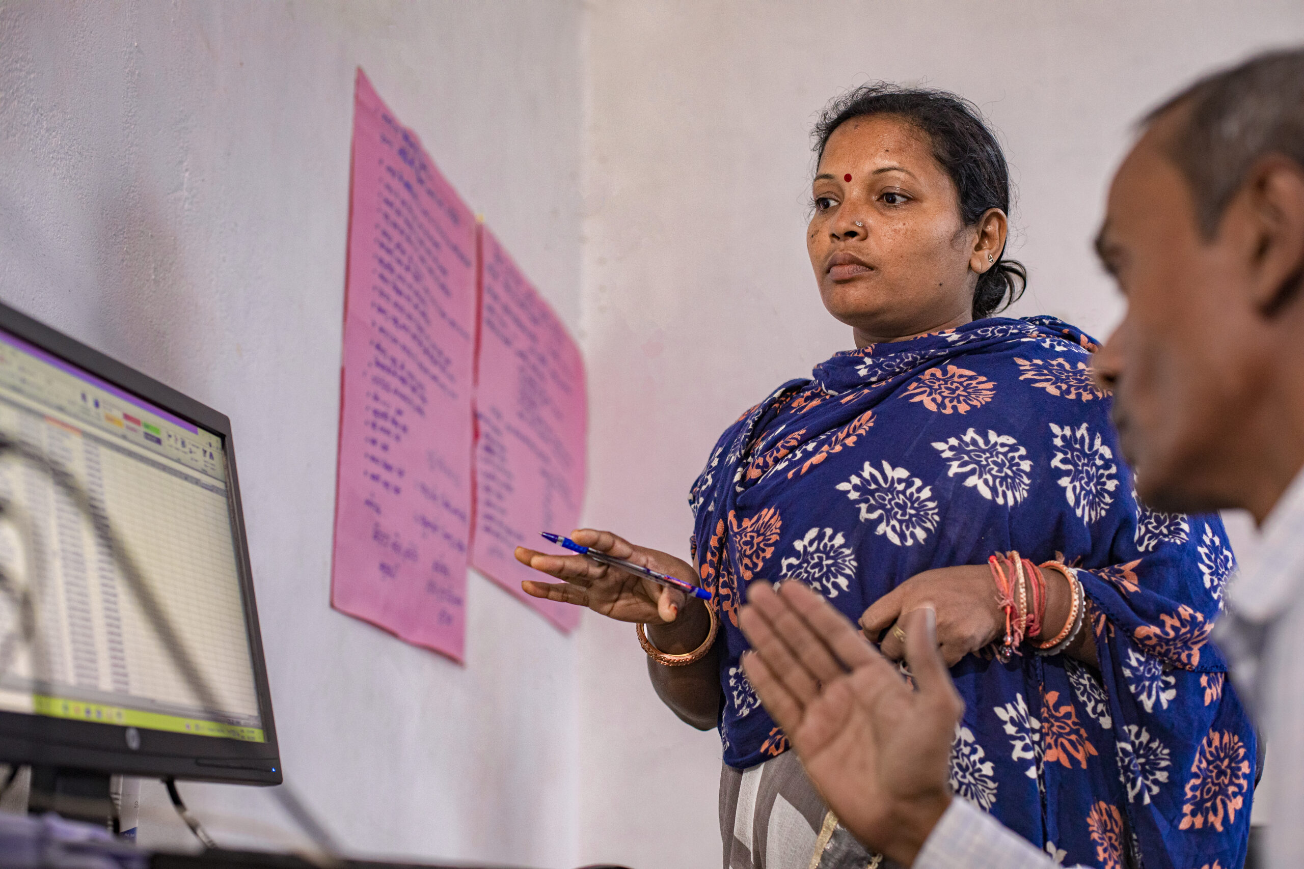 Woman reviews data on a computer.