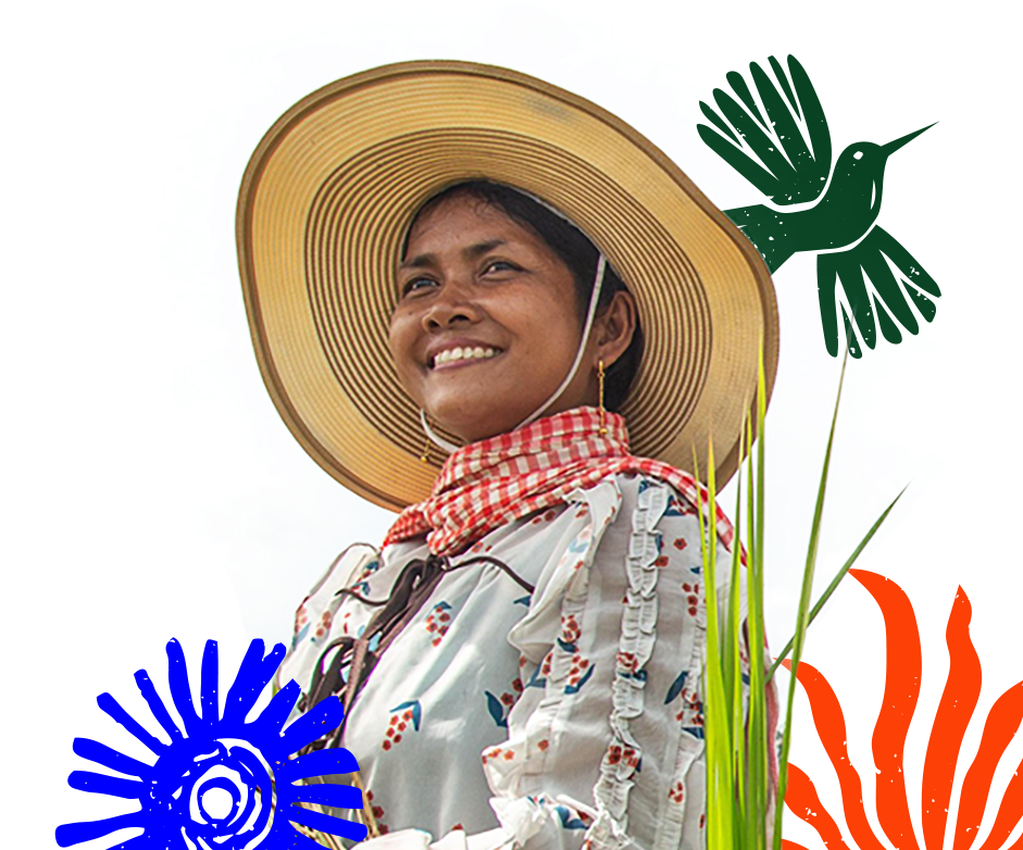 Woman with wide-brimmed hat smiling.