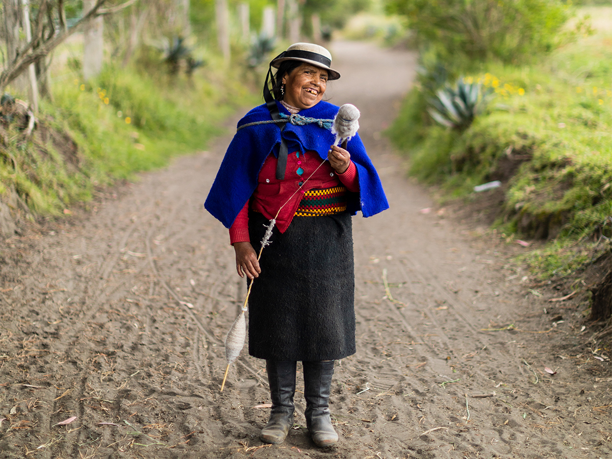 Maria Micaela Castro Sisa, 48, spins wool as she walks down a path in a village near Riobamba, Ecuador. 