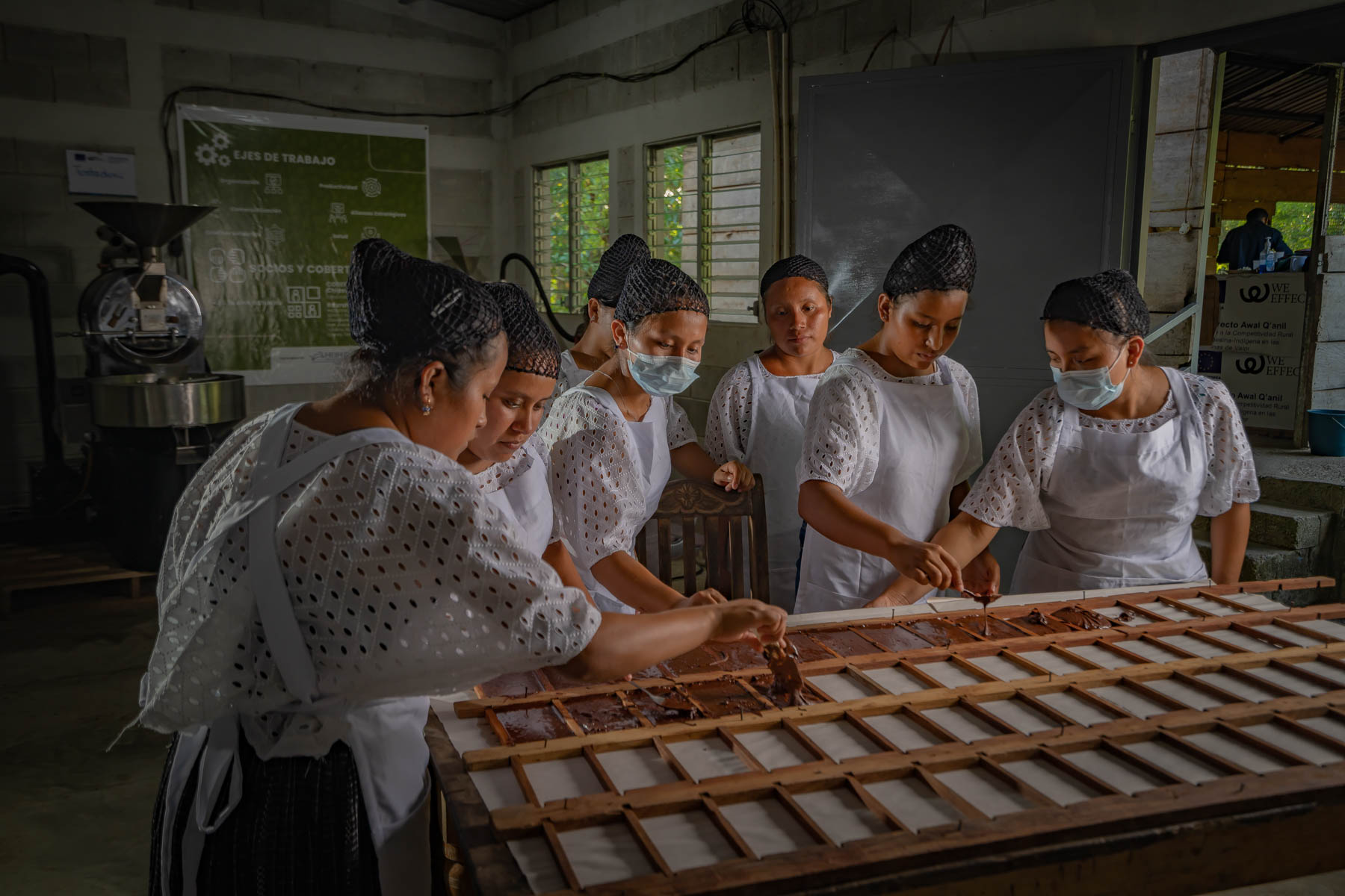 Women of the ADIRA cooperative make artisanal chocolate tablets.