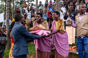 Participants exchange gifts at community event.