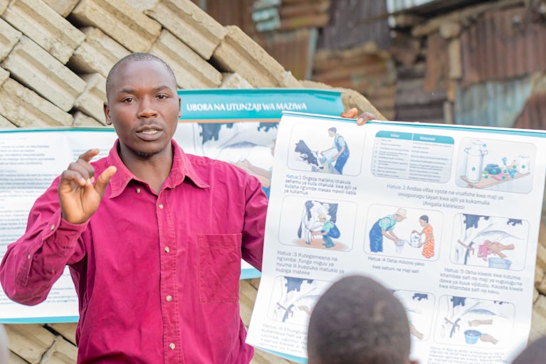A community agrovet in Tanzania educates farmers on livestock health and care practices.