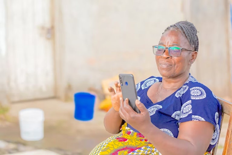 A woman looking at her smart phone