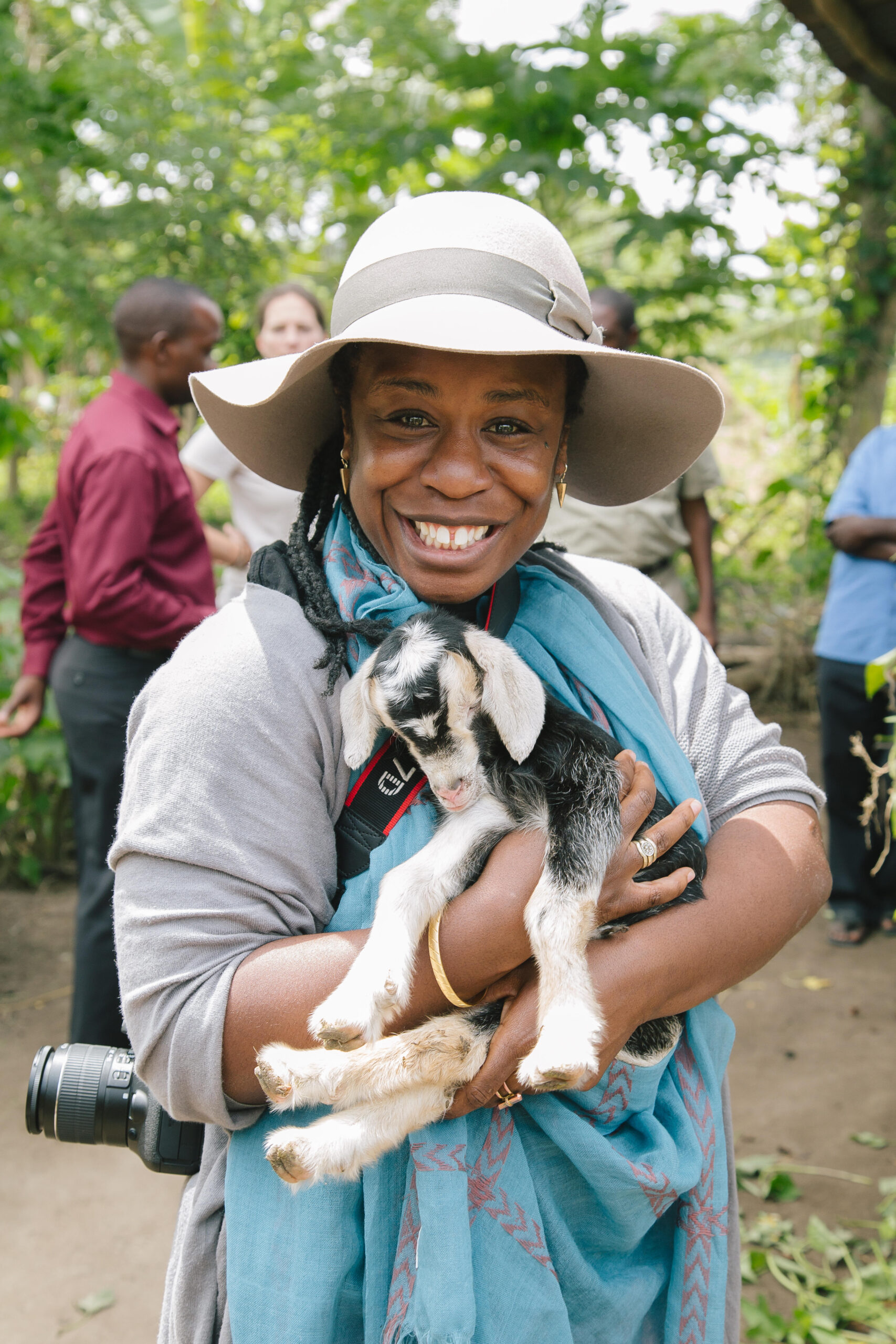 Uzo holds a newborn goat at a farm in Luweero, Uganda. Emmy Award Winning Actress Uzo Aduba Visits Heifer International Farmers in Uganda