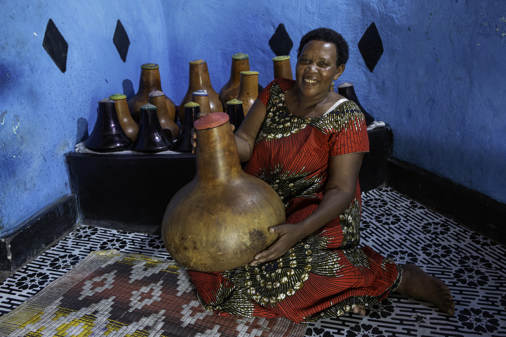 Margret holds a gourd.