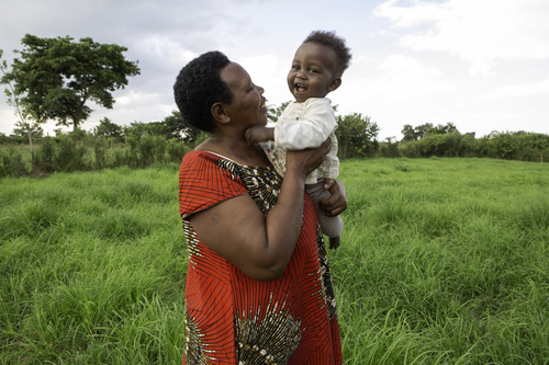 Margret Wantege, 61, walks and plays with her grandson Elijah Bujingo in Uganda.
