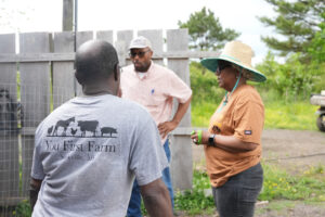 Three people talking in a circle.
