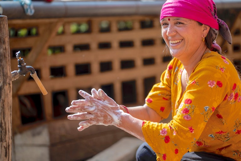 A woman washing her hands