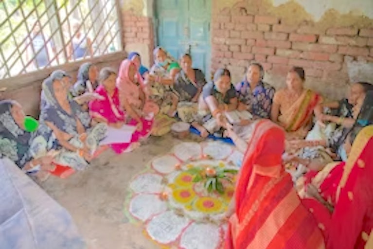 Women sitting around in a circle talking