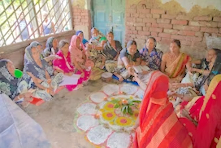 Women sitting around in a circle talking