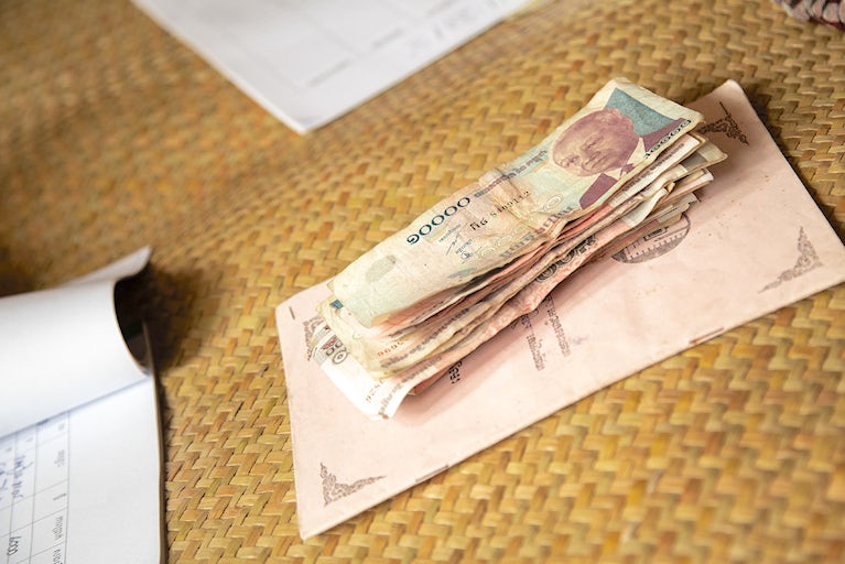 Cambodian money and ledger.