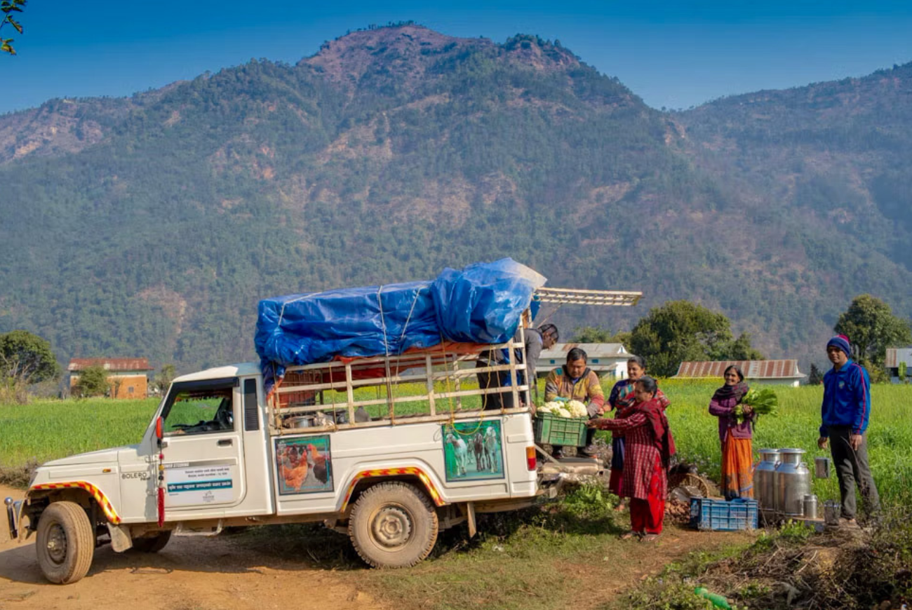 Farmers in Nepal use a truck to take their produce to market.