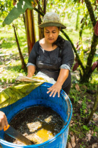 Robles shows her organic fertilizer. Photo by Joe Tobiason.