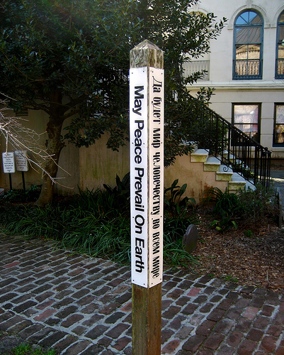 A wooden peace pole. 