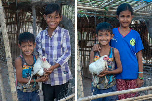 Savi's children holding their chicken