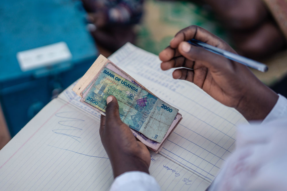 A hand counting currency notes. 